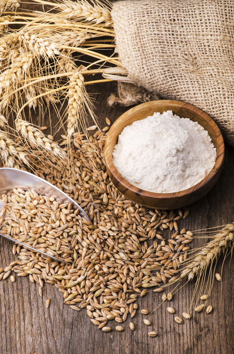 ears of wheat with flour and cereals